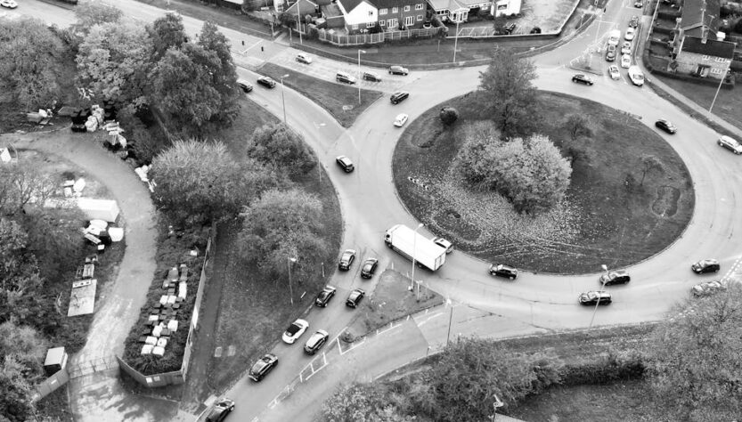 grayscale shot of a roundabout in a city